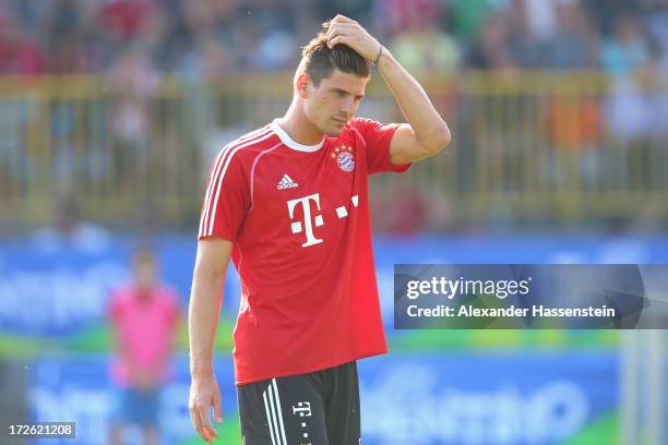 Mario Gomez of FC Bayern Muenchen reacts during a training session at Campo Sportivo on July 4, 2013 in Arco, Italy.