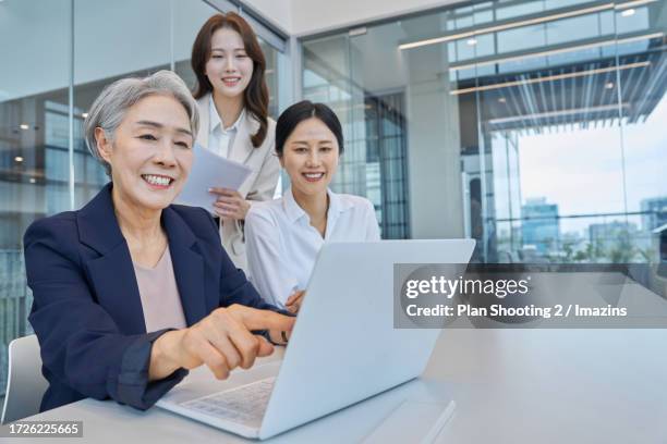 woman, ceo, person in charge, elderly woman, working senior, smile - executive smile pointing bildbanksfoton och bilder