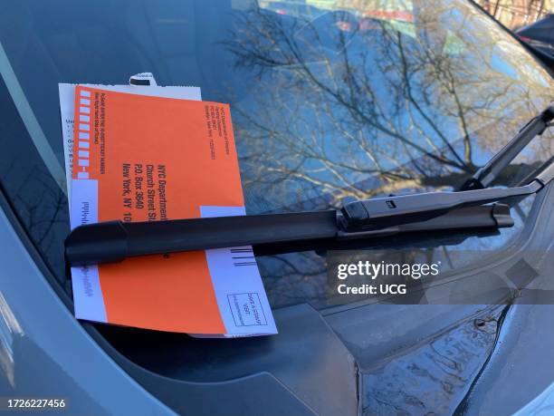 Car with Parking Ticket under windshield wiper, New York City.