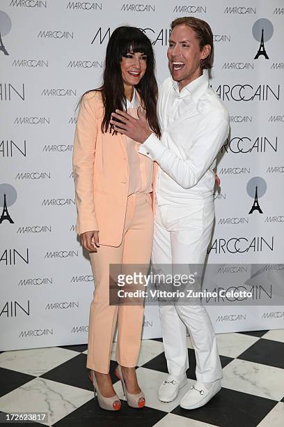 Mariella Ahrens and Jens Hilbert attend the Marc Cain Photocall during the Mercedes-Benz Fashion Week Spring/Summer 2014 at the Hotel Adlon on July...