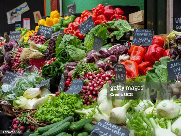 Fresh vegetable stall in Borough Market, London, UK.