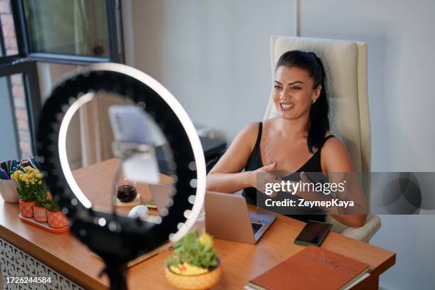 woman shooting video for social media with ring light and mobile phone. - ring light stock pictures, royalty-free photos & images