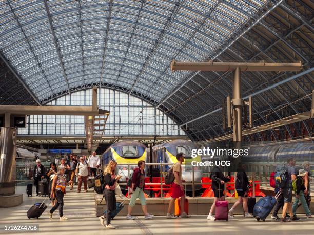 People arriving on a Eurostar train at St Pancras International station, London, UK.