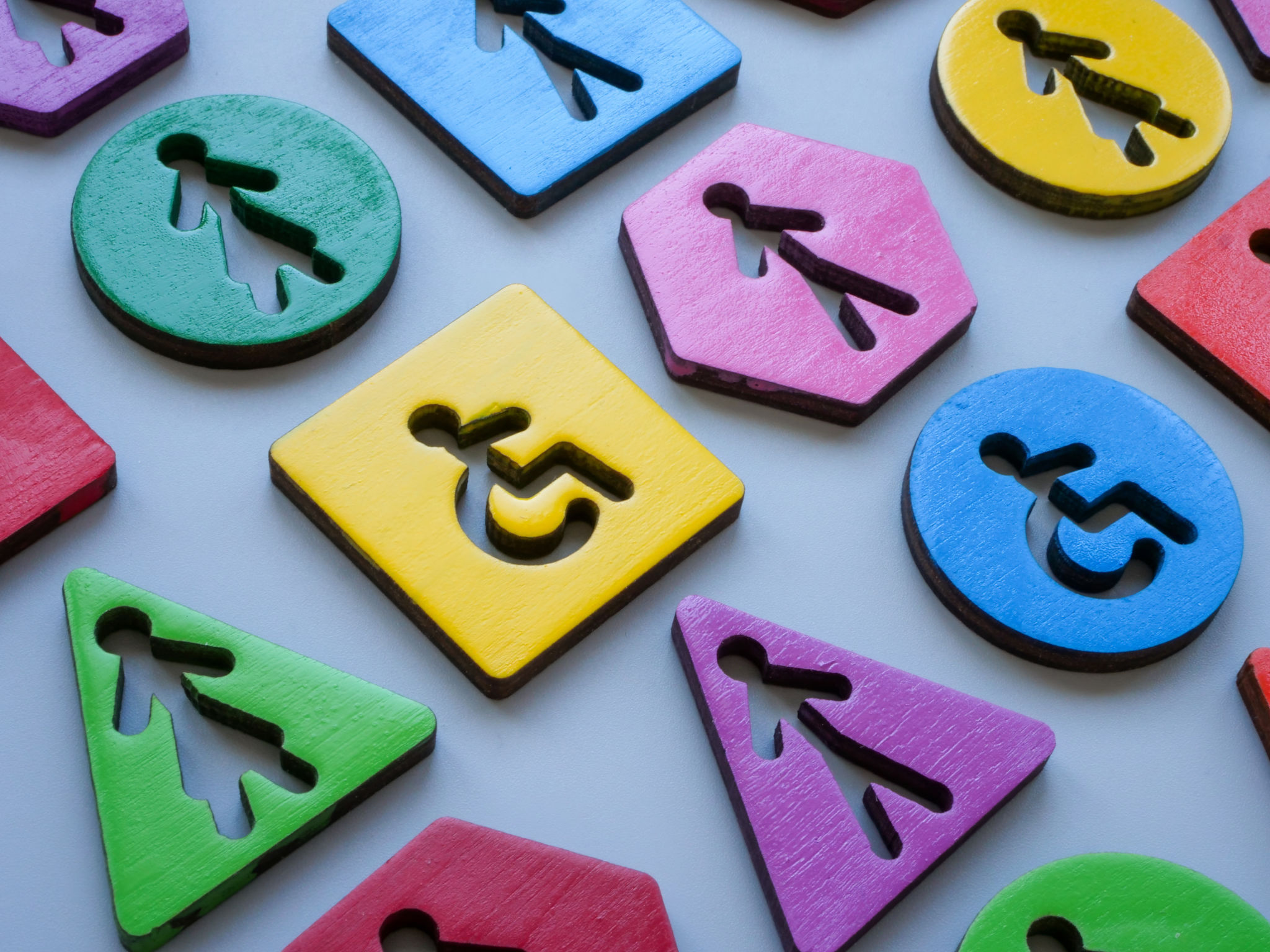 Different colorful figurines as a concept of inclusion and diversity. Different colorful figurines as a concept of inclusion and diversity.