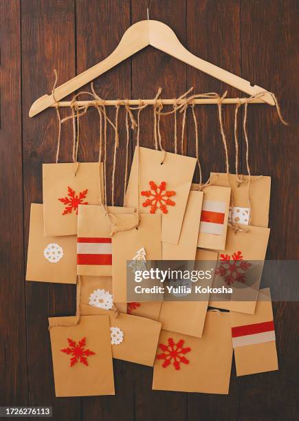 christmas advent calendar hanging on a wall - child with advent calendar stock pictures, royalty-free photos & images