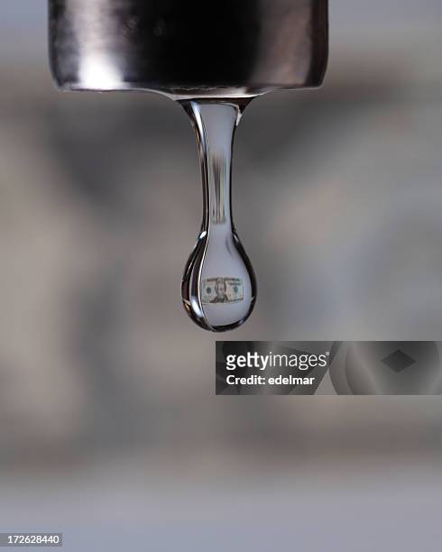 small dollar image inside a close up photo of a faucet drip - water leak stock pictures, royalty-free photos & images
