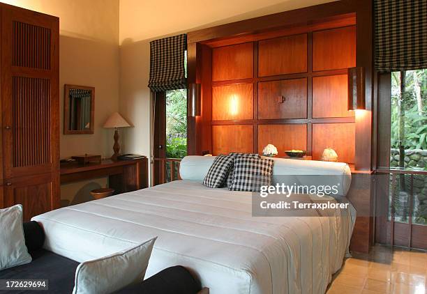 teak bedroom in luxury resort - minimalist bedroom desk stock pictures, royalty-free photos & images