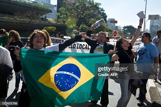 Civilian police officers take part in a demonstration against their low salaries and bad working conditions, in Sao Paulo, Brazil, on July 4, 2013....