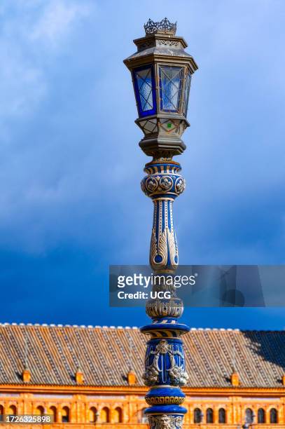 Seville, Spain, Street light lamp in the Plaza de Espana. Architectural feature or detail of a metallic structure.