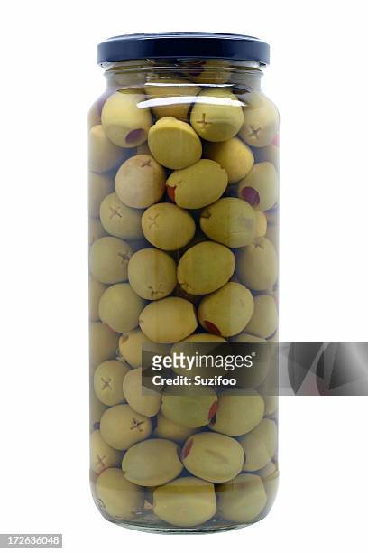 green olives - filling jar stock pictures, royalty-free photos & images