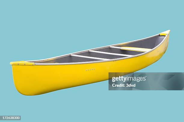 isolated yellow canoe on blue background - kano stockfoto's en -beelden