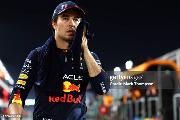 Sergio Perez of Mexico and Oracle Red Bull Racing walks to the grid prior to the F1 Grand Prix of Qatar at Lusail International Circuit on October...