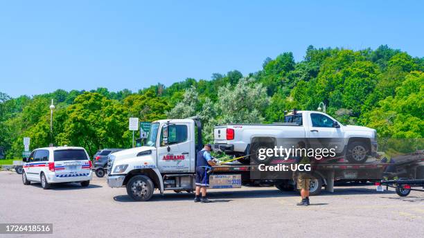 Toronto, Canada, Toronto Parking Authority is towing vehicles violating parking regulations in Bluffer's Park.