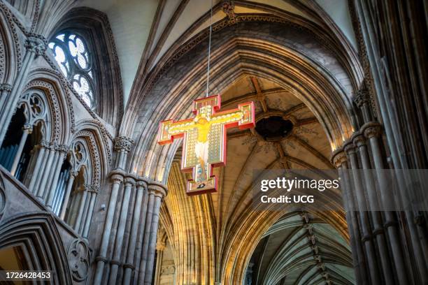 The giant crucifixion icon known as 'Christ Crucified, Risen and Lord of All' suspended from the ceiling above the nave altar in Lichfield Cathedral,...
