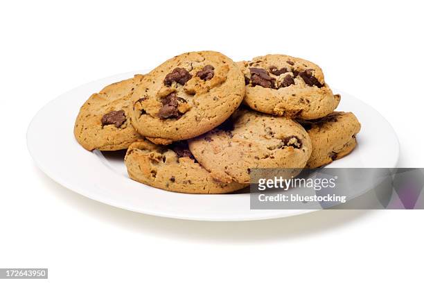 plate of chocolate chip cookies - cookie stock pictures, royalty-free photos & images