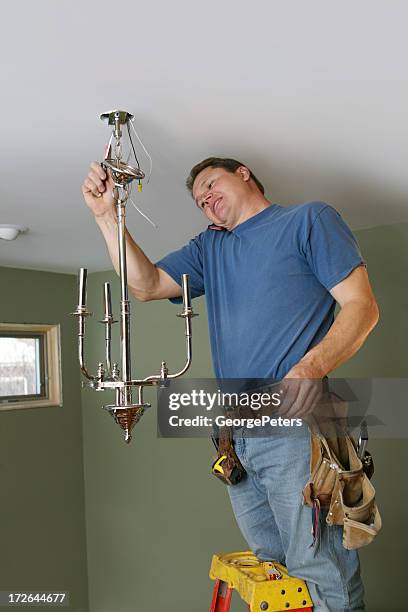 multi tasking on a busy day - fitting stockfoto's en -beelden