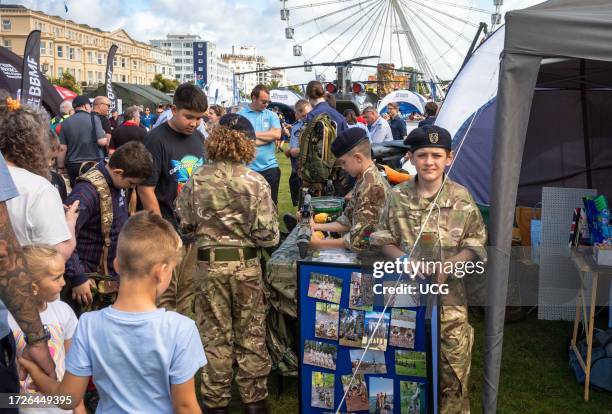 Young Army Cadets in military uniform at a display stand in the military exhibition alongside the annual Eastbourne Airbourne, an international...