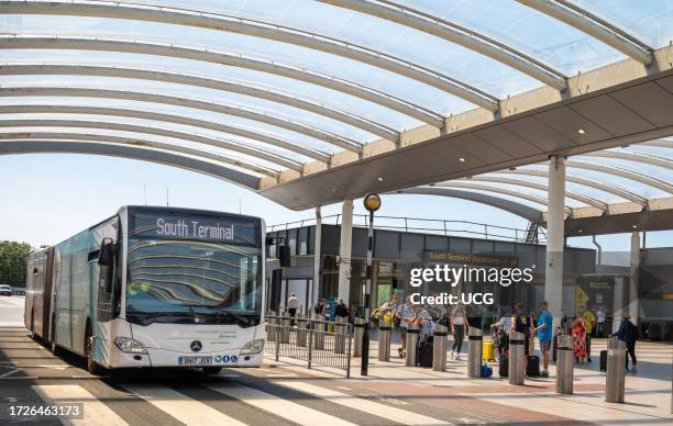 Bus that shuttles passengers to and from long term car parks arrives at London Gatwick Airport, South Terminal, West Sussex, UK.