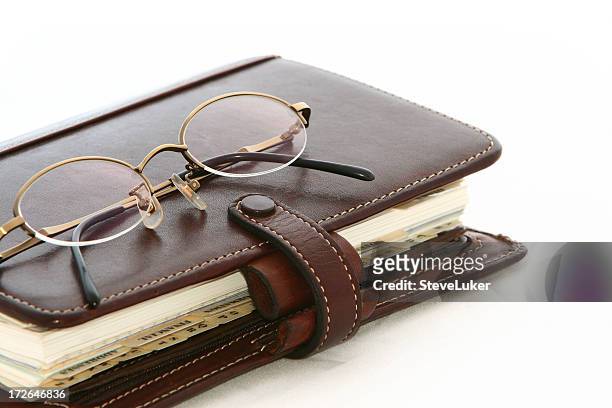 glasses on diary. - leather journal stock pictures, royalty-free photos & images