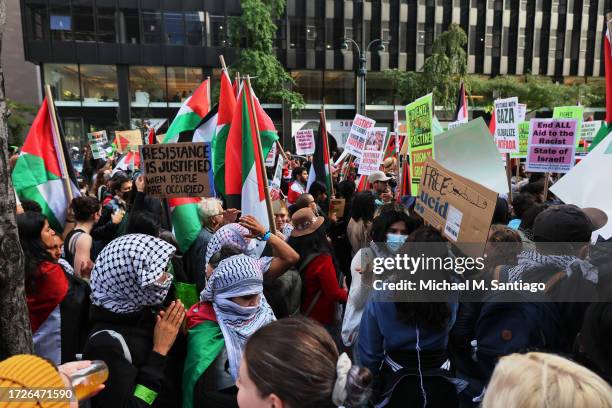 Pro-Palestinian demonstrators gather in support of the Palestinian people during a rally for Gaza at the Consulate General of Israel on October 09,...