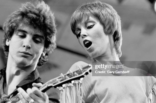 American Rock musicians Neil Giraldo, on electric guitar, and singer Pat Benatar perform onstage during the Dr Pepper Summer Music Festival in...