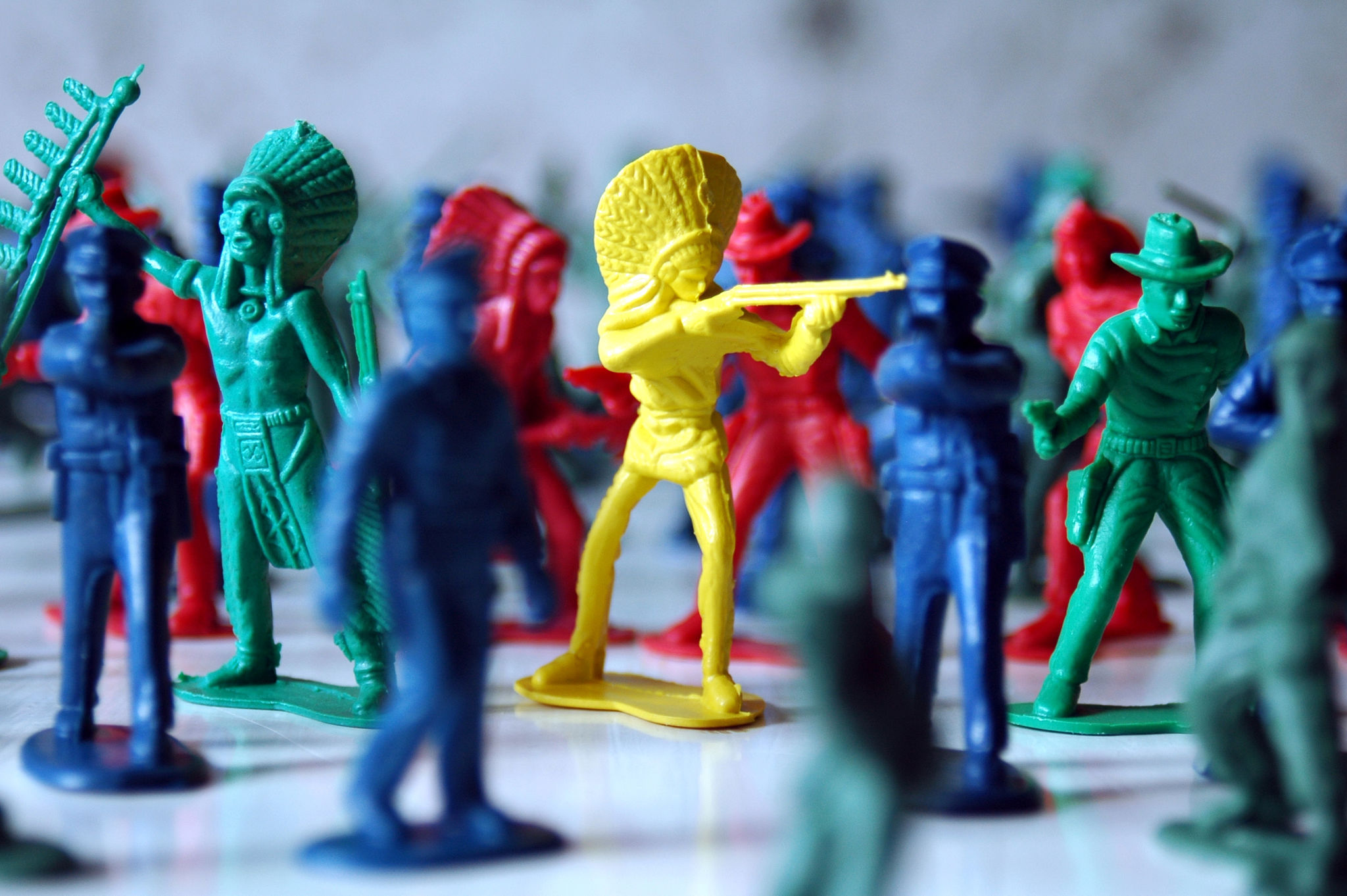 Macro photo of colorful soldiers and American Indian figures Macro photo of colorful soldiers and American Indian figures