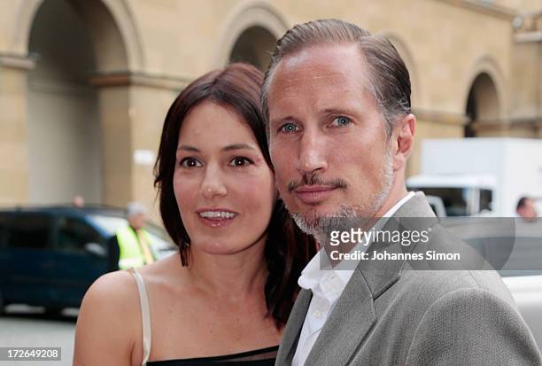 German actor Benno Fuermann and actress Nicolette Krebitz arrive for the Bernhard Wicki Award ceremony at Munich film festival on July 4, 2013 in...