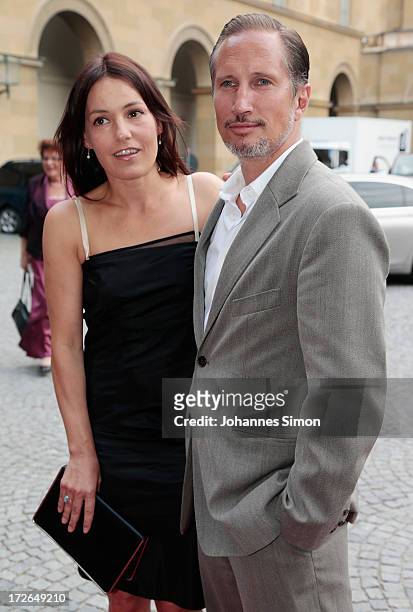 German actor Benno Fuermann and actress Nicolette Krebitz arrive for the Bernhard Wicki Award ceremony at Munich film festival on July 4, 2013 in...