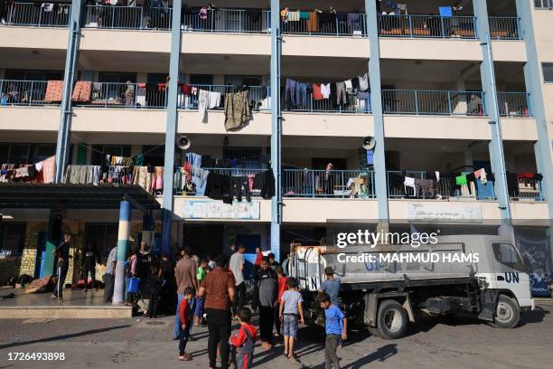 Graphic content / Internally displaced Palestinians take refuge in a United Nations-run school in the southern of Gaza Strip city of Khan Yunis on...