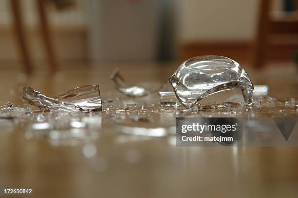 close up of broken glass on floor - breaking stock pictures, royalty-free photos & images