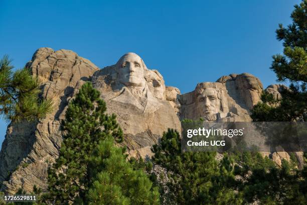 Carved granite busts of George Washington, Thomas Jefferson, Theodore "Teddy" Roosevelt and Abraham Lincoln at Mount Rushmore National Monument near...