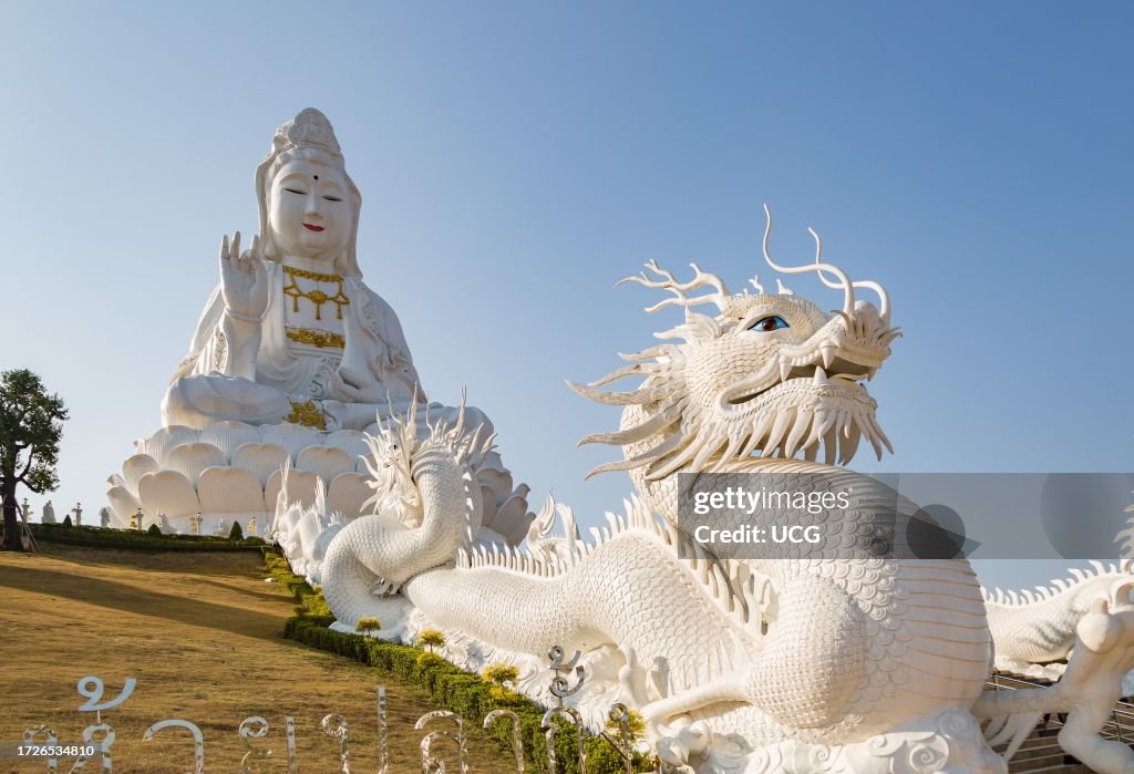 Chinese dragons line the steps up to the Guan Yin (Goddess of Mercy) statue at Wat Huay Pla Kang Temple in Chiang Rai province of Northern Thailand