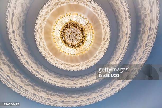 Ornate recessed light fixtures in the ceiling inside the Guan Yin statue at Wat Huay Pla Kang Temple in Chiang Rai province of Northern Thailand.