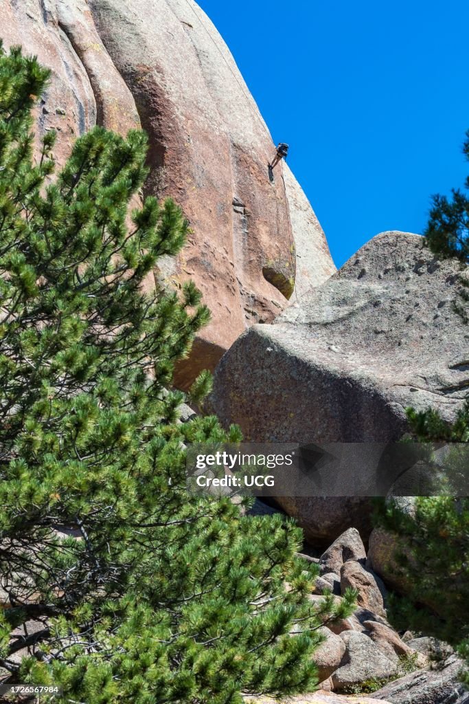 Man rock climbing in the Vedauwoo Recreation Area of Medicine Bow National Forest in Wyoming