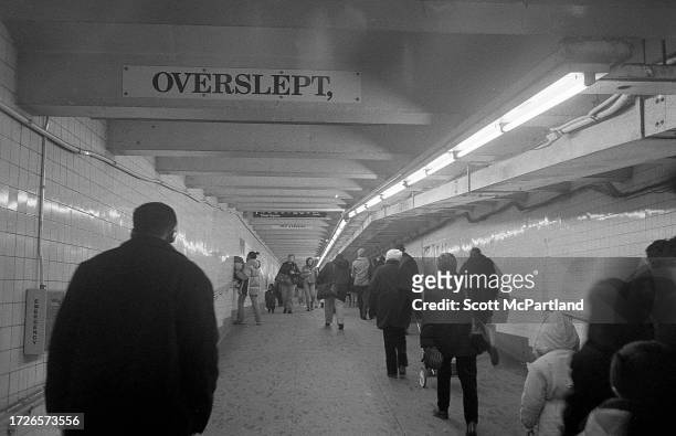View of commuters as they walk along the pedestrian tunnel at the 42nd Street Times Square subway station, New York, New York, November 12, 2000....