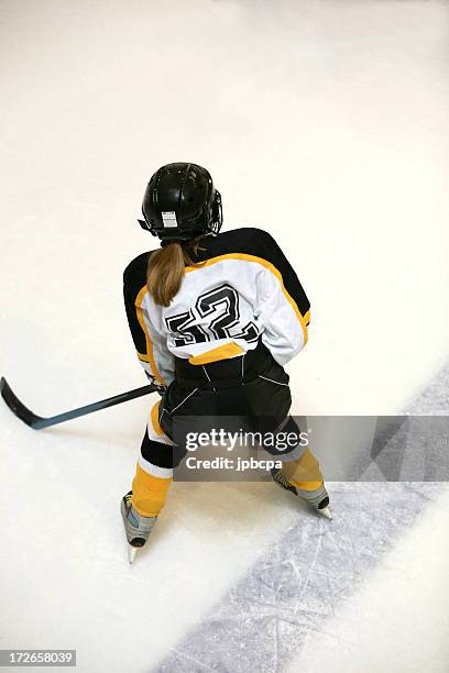 girl hockey player top view - girls ice hockey stock pictures, royalty-free photos & images