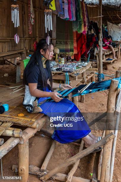 Tribal woman weaving scarves to be sold in the Long Neck Karen tribe area of the Union of Hill Tribe Villages outside of Chiang Rai in the Nanglae...