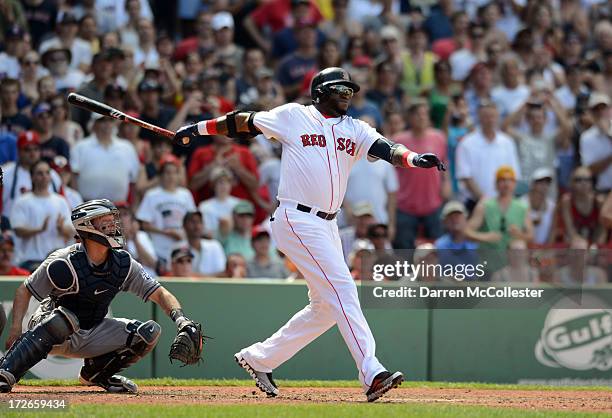 David Ortiz of the Boston Red Sox hits a two run single in the bottom of the sixth against the San Diego Padres at Fenway Park on July 4, 2013 in...