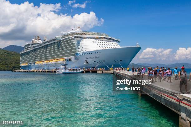 Cruise passengers disembark from the Royal Caribbean Allure of the Seas cruise ship on Royal Caribbean's private coastal peninsula of Labadee, Haiti.