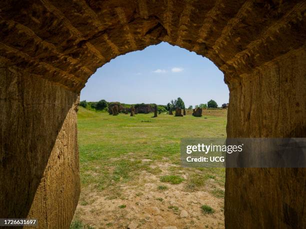 View through stone arch of the Stone circle on ham hill built by the Millennium Project to commemorate the centuries of quarrying on Ham Hill and the...