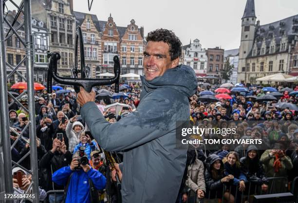 Belgian Greg Van Avermaet hangs his bike on a hook as part of a farewell event 'Goodbye Greg' for cyclist Van Avermaet, in Dendermonde, on October...