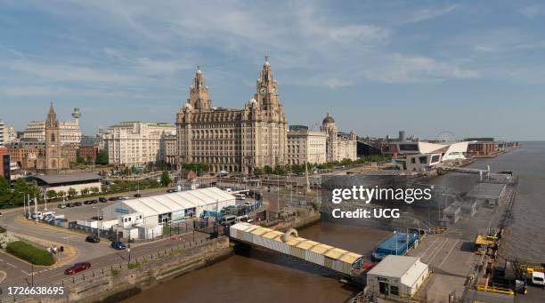 Liverpool, England, UK, Liverpool Cruise Terminal and walkway for cruise passengers along the famous waterfront, with The Liver building, and River...