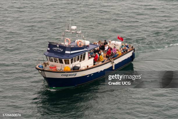 St Marys, Scilly Isles, UK, Inter island ferry with passengers aboard approaching the harbor in St Marys.