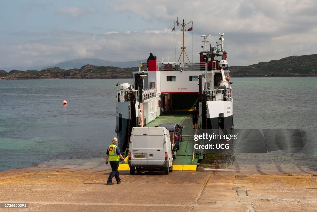 Isle of Iona, Mull, Scotland, UK. Vehicles loading MV Loch Buie via a metal ramp onto the roro ferry across the Sound of Iona a short stretch of water to the port of Fionnphort on Mull.