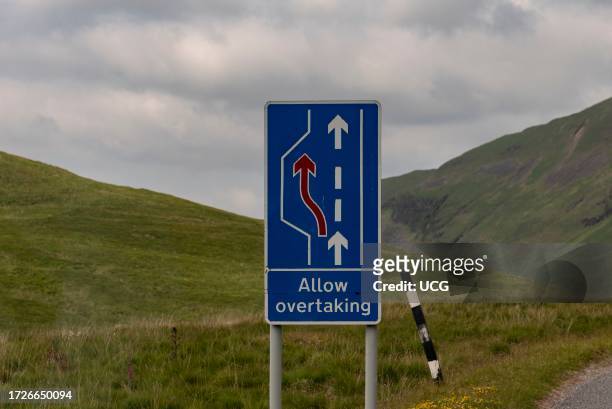 Isle of Mull, Scotland, UK, Allow overtaking road sign. Information for motorists on a single lane highway to drive into a parking place and allow...