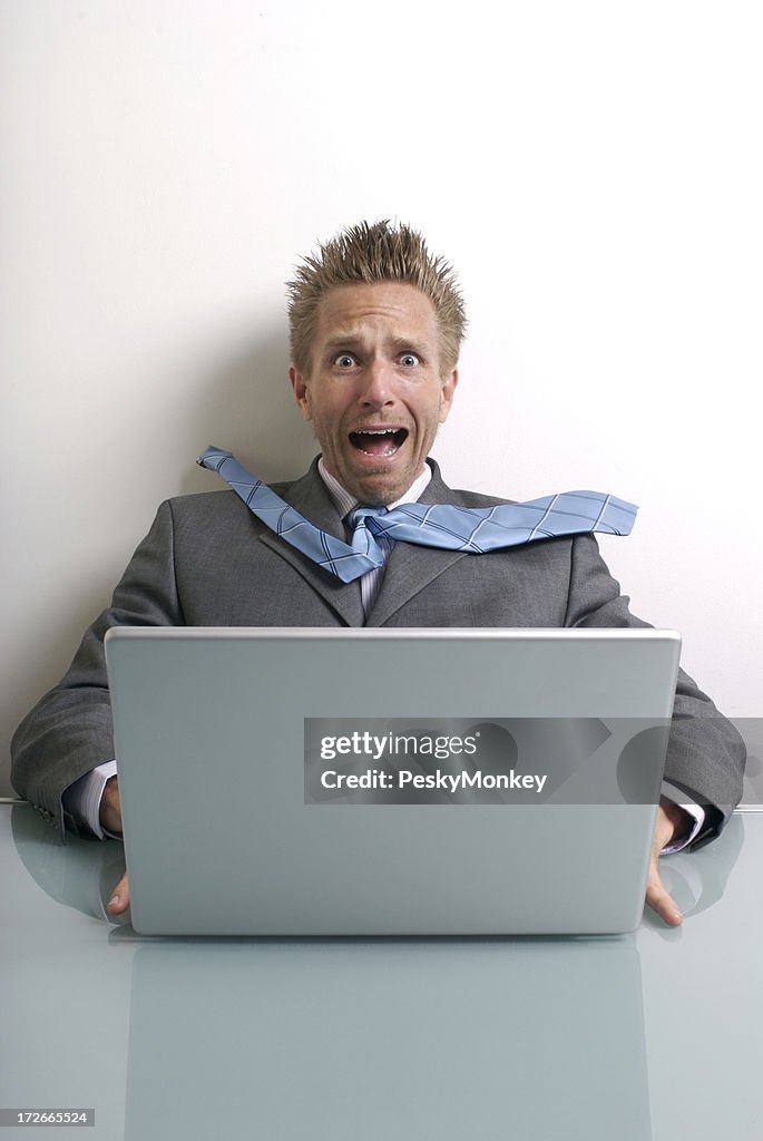Stressed Businessman Sitting at Computer Frightened Expression