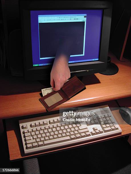 illustration of a hand coming through monitor stealing money - digital wallet stock pictures, royalty-free photos & images
