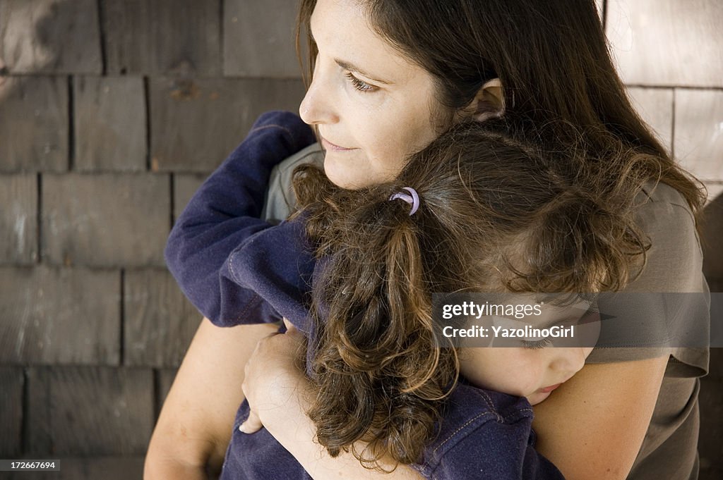 Mother holding daughter (series)