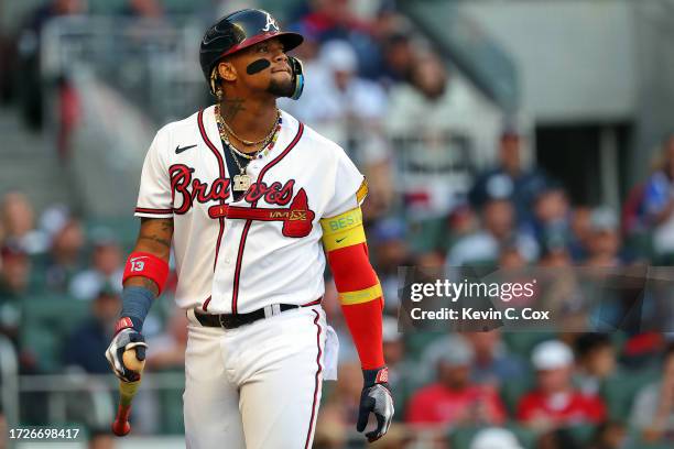 Ronald Acuna Jr. #13 of the Atlanta Braves reacts after striking out in the first inning against the Philadelphia Phillies during Game Two of the...