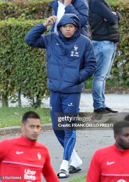 France's forward Kylian Mbappe arrives for a training session ahead of the national team's friendly football match against Scotland at the LOSC...
